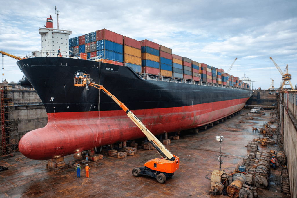 Container vessel in dry dock undergoing hull cleaning and maintenance for CII compliance